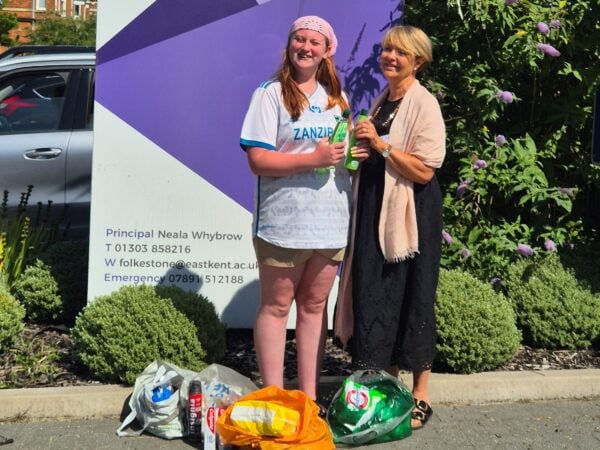 Katya (student) with Caroline from Action on Homelessness, with the donated items